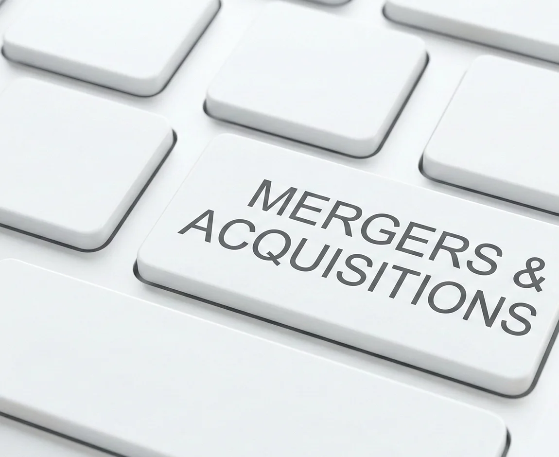 Keyboard key with the text: Mergers & Acquisitions